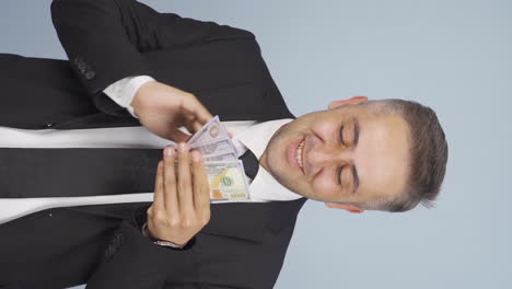 Vertical-video-of-Businessman-who-loves-money.